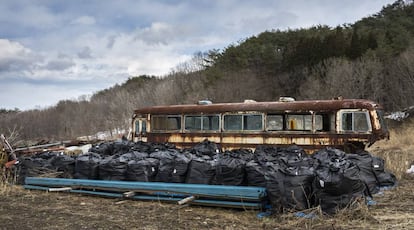 The operators store the radioactive waste in black bags.