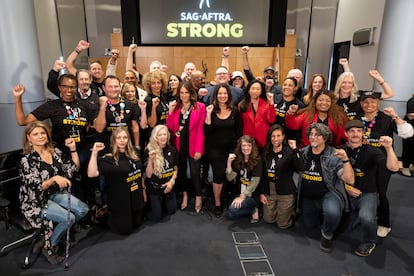 Fran Drescher (center, in black) and Duncan Crabtree-Ireland (behind her) pose with the SAG-AFTRA negotiating committee at the union's headquarters in Los Angeles, California, on Friday November 10, 2023.