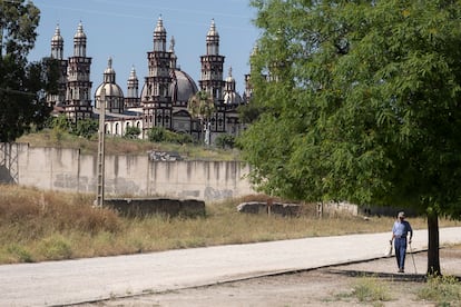 A man walks next to the Palmariana Christian Church in El Palmar de Troya.