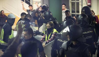 National Police officers seize ballot boxes on October 1.