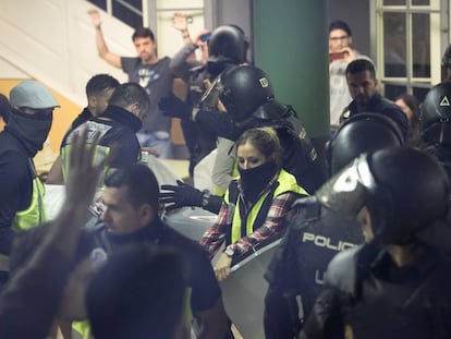 National Police officers seize ballot boxes on October 1.