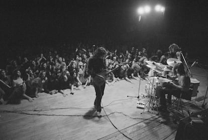 Rory Gallagher in concert at Leeds City Hall (England) with drummer Wilgar Campbell and bassist Gerry McAvoy; March 25, 1972.