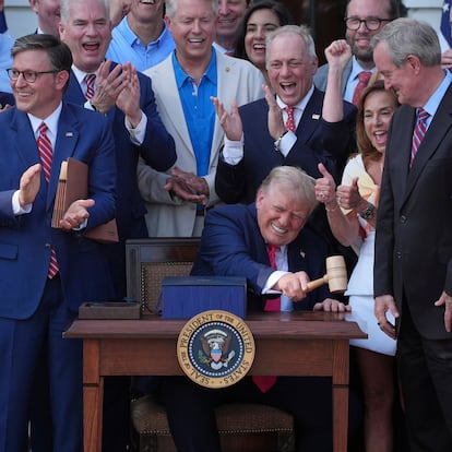 President Donald Trump bangs a gavel presented to him by House Speaker Mike Johnson of La., after he signed his signature bill of tax breaks and spending cuts at the White House, Friday, July 4, 2025, in Washington. (AP Photo/Evan Vucci)