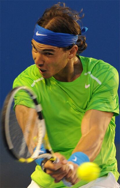 Rafael Nadal thumps a return during his match against Roger Federer.