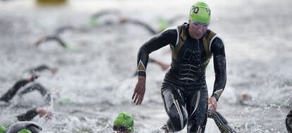 The Swedish winner of the silver medal, Lisa Norden, leaves the water to continue the triathlon.