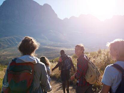 A group of friends trekking in the mountains.