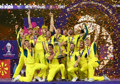 Australian players celebrate with the trophy after winning the ICC Cricket World Cup, on November 19, 2023.