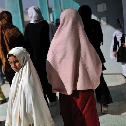 Afghan schoolgirls attend the Mirweis school where 16 girls were sprayed with acid by Taliban sympathizers while walking to school on November 12, in Kandahar, Afghanistan, February 7, 2009.  Most of the girls at the Mirweis school have resumed attending, despite constant threats to their safetly. President Hamid Karzai is expected to run in this year's presidential elections on August 20, 2009, and the situation around the country is constantly in demise. Afghanistan has been plagued by war for three decades, and Afghans continue to struggle with severe poverty and a gross lack of security in many areas across the country.  (Credit: Lynsey Addario for The New York Times) 


