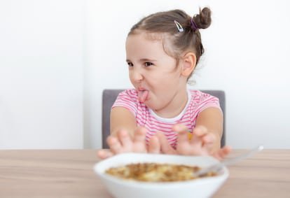 Little girl refusing to eat her food