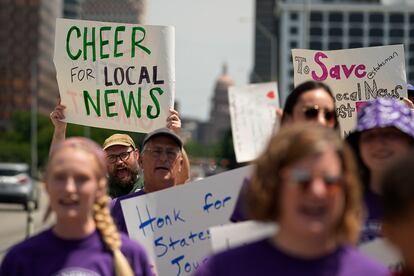 Editorial members of the Austin American-Statesman's Austin NewsGuild picket along the Congress Avenue bridge in Austin, Texas