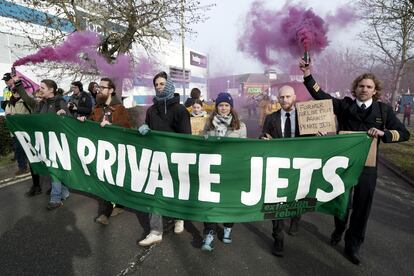 Cimate activist Greta Thunberg, third right, takes part in a march to Farnborough Airport in southern England, Saturday Jan. 27, 2024.