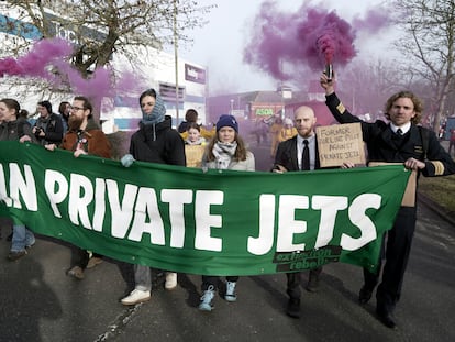 Cimate activist Greta Thunberg, third right, takes part in a march to Farnborough Airport in southern England, Saturday Jan. 27, 2024.