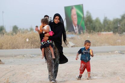 Iraquíes que huyeron a Siria por la violencia regresan a su país este sábado.