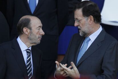 Rubalcaba (left) and Rajoy chat during the October 12 military parade.