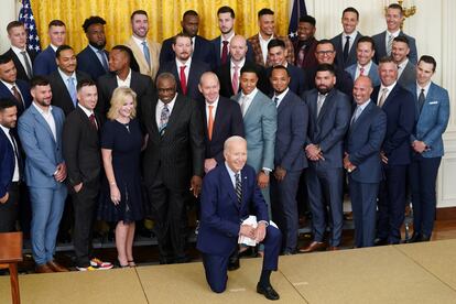 President Joe Biden kneels for a photo during an event celebrating the 2022 World Series champions the Houston Astros at the White House in Washington, on August 7, 2023.