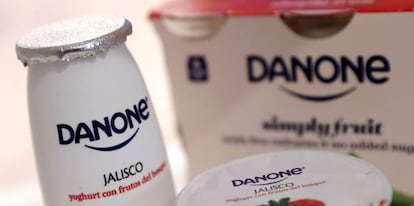 FILE PHOTO: Company logos are seen on products displayed before French food group Danone 2019 annual results presentation in Paris, France, February 26, 2020. REUTERS/Christian Hartmann/File Photo