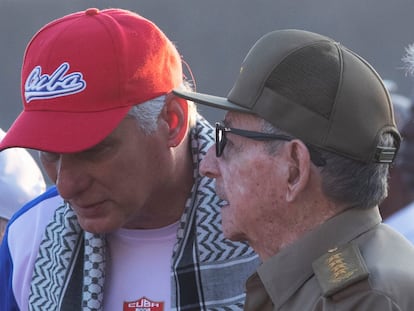 Cuba's former president Raúl Castro speaks to President Miguel Díaz-Canel during the International Workers' Day celebration in Havana, Cuba, May 1, 2024.