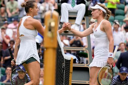 Aryna Sabalenka of Belarus, left, shakes hands with Russia's Ekaterina Alexandrova after beating her during their women's singles match on day eight of the Wimbledon tennis championships in London, Monday, July 10, 2023.