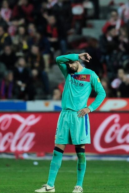 Piqué, durante un momento del partido ante el Sporting