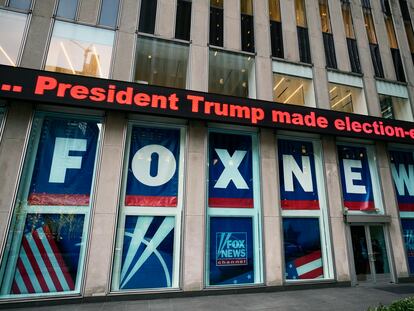 FILE - A headline about President Donald Trump is displayed outside Fox News studios in New York on Nov. 28, 2018.  (AP Photo/Mark Lennihan, File)