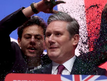 A protester throws glitter at Britain's Labour Party Leader Starmer at the party's annual conference in Liverpool.