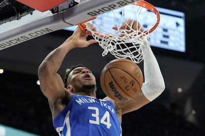 Milwaukee Bucks' Giannis Antetokounmpo dunks during the second half of an NBA basketball game against the San Antonio Spurs Wednesday, March 22, 2023, in Milwaukee.