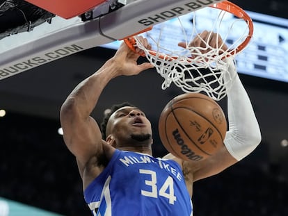 Milwaukee Bucks' Giannis Antetokounmpo dunks during the second half of an NBA basketball game against the San Antonio Spurs Wednesday, March 22, 2023, in Milwaukee.