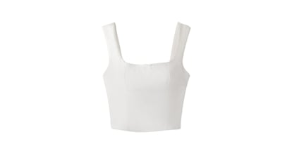 Crop-top de tirantes con lazo de Bershka, estilo camiseta interior y disponible en varios colores. Tendencia pointelle.