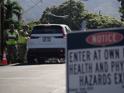The Hawaii National Guard checks on a car passing the checkpoint on Kaniau Street on Monday, Sept. 25, 2023