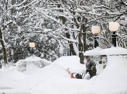 A Buffalo resident tries to shovel snow this Monday, December 26.