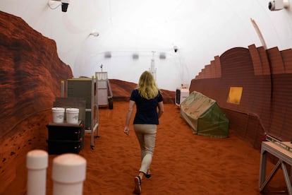 Dr. Suzanne Bell, from NASA, walks around the outer area of the base, which simulates a Martian landscape.