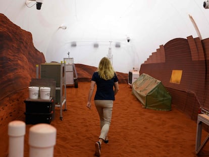 Dr. Suzanne Bell, from NASA, walks around the outer area of the base, which simulates a Martian landscape.