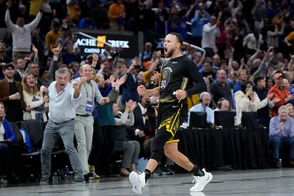 Golden State Warriors guard Stephen Curry (30) celebrates after making a 3-point basket during the second half of an NBA basketball game against the Milwaukee Bucks in San Francisco, Saturday, March 11, 2023.