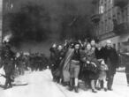 FILE - In this 1943 file photo, a group of Polish Jews are led away for deportation by German SS soldiers during the destruction of the Warsaw Ghetto by German troops after an uprising in the Jewish quarter. A Warsaw court is scheduled to deliver a verdict Tuesday, Feb. 9, 2021 in a closely watched libel case in which Polish national dignity and the independence of Holocaust research are said to be at stake. (AP Photo, file)