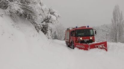 Firefighters in Catalonia clearing snow from the road.