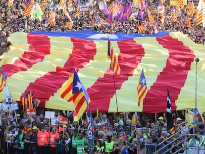 Protesters in Madrid carry a large estelada flag in the march against the trial of the separatist leaders.