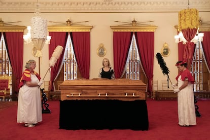 Veronica Gail Kawananakoa, center, wife of Abigail Kinoiki Kekaulike Kawananakoa, stands by her wife's casket during a public memorial at 'Iolani Palace, Sunday, Jan. 22, 2023, in Honolulu.