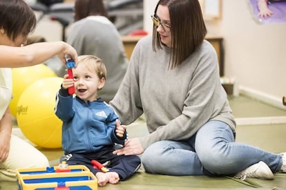 Tiago plays with his mother.