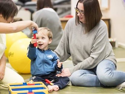 Tiago plays with his mother.