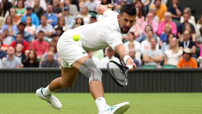 LONDON, ENGLAND - JULY 02: Novak Djokovic of Serbia reaches to play a backhand against Vit Kopriva of Czechia in his Gentlemen's Singles first round match during day two of The Championships Wimbledon 2024 at All England Lawn Tennis and Croquet Club on July 02, 2024 in London, England. (Photo by Sean M. Haffey/Getty Images)