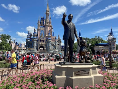 People gather at the Magic Kingdom theme park before the "Festival of Fantasy" parade at Walt Disney World in Orlando, Florida, U.S. July 30, 2022