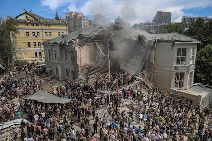 Aid workers and civilians clear rubble at the Ohmatdit children's cancer hospital in Kiev after a Russian attack on Monday.