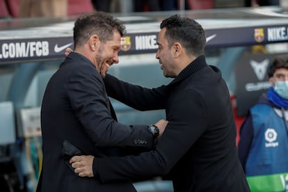 Simeone y Xavi Hernández