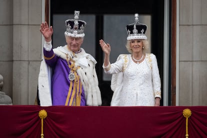 King Charles and Queen Camilla wave from the Buckingham balcony after being crowned last May.