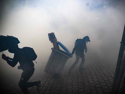 Protestors clash with police officers during a demonstration in Nantes, western France, on April 13, 2023.