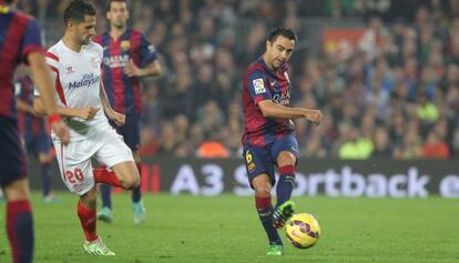 Xavi, en un partido de Liga contra el Sevilla esta temporada.