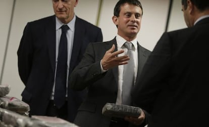 French Interior Minister Manuel Valls holds cocaine that was confiscated at Charles De Gaulle International Airport.