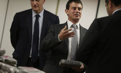 French Interior Minister Manuel Valls holds cocaine that was confiscated at Charles De Gaulle International Airport.