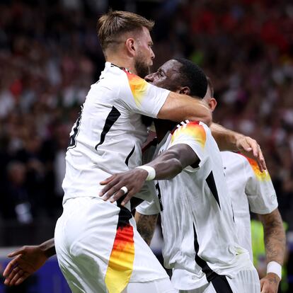 FRANKFURT AM MAIN, GERMANY - JUNE 23: Niclas Fuellkrug of Germany celebrates scoring his team's first goal with teammate Antonio Ruediger during the UEFA EURO 2024 group stage match between Switzerland and Germany at Frankfurt Arena on June 23, 2024 in Frankfurt am Main, Germany. (Photo by Alexander Hassenstein/Getty Images)