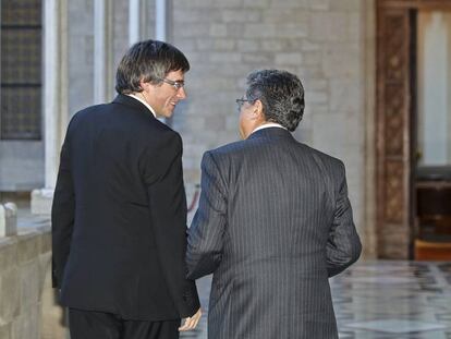 El presidente de la Generalitat, Carles Puigdemont y el nuevo delegado del Gobierno en Cataluña, Enric Millo.